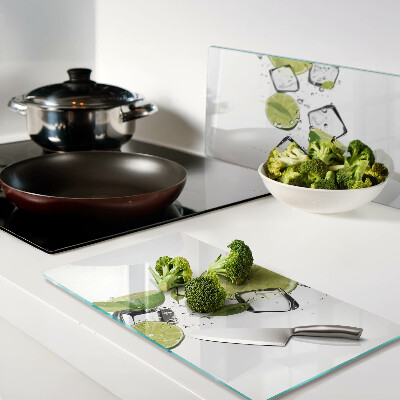 Glass kitchen board Lemons with ice in water
