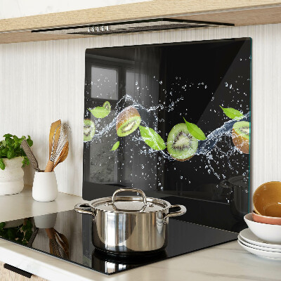 Glass chopping board Kiwi in water with leaves