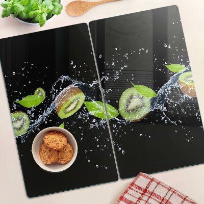 Glass chopping board Kiwi in water with leaves