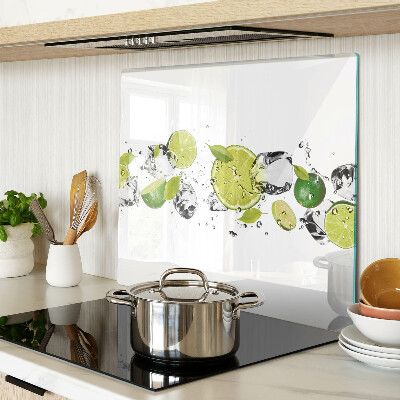 Glass kitchen board Lemons and ice in water