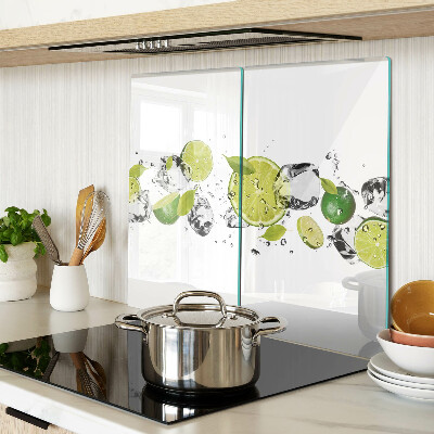 Glass kitchen board Lemons and ice in water