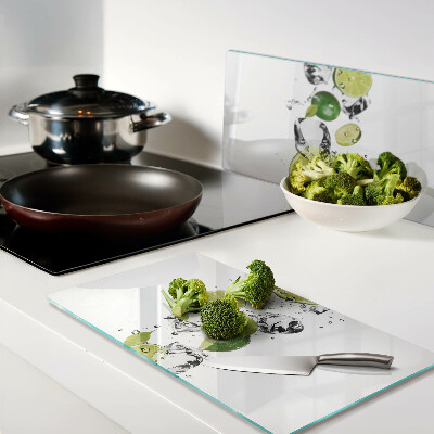 Glass kitchen board Lemons and ice in water