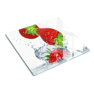 Glass chopping board Strawberries in water