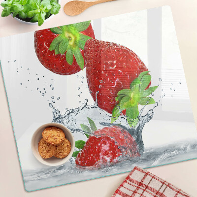 Glass chopping board Strawberries in water