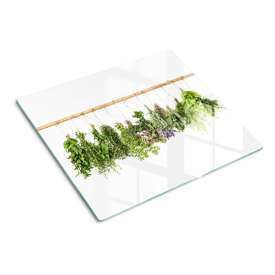 Glass chopping board Dried herbs on a string