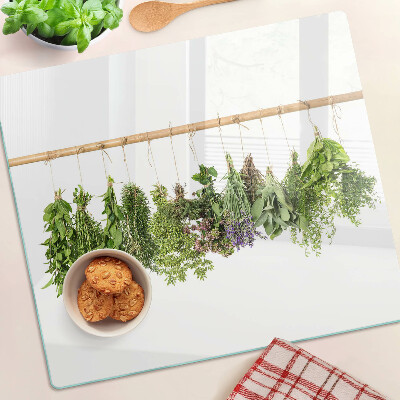 Glass chopping board Dried herbs on a string