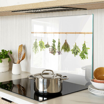 Glass chopping board Herbs dried on a string