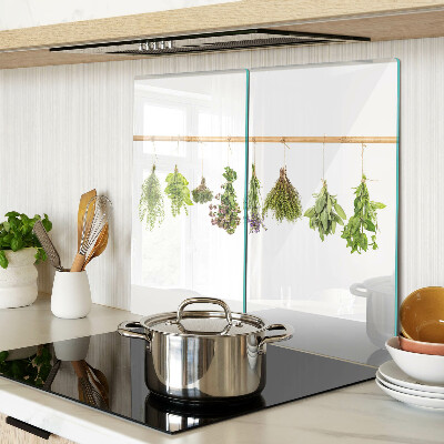 Glass chopping board Herbs dried on a string