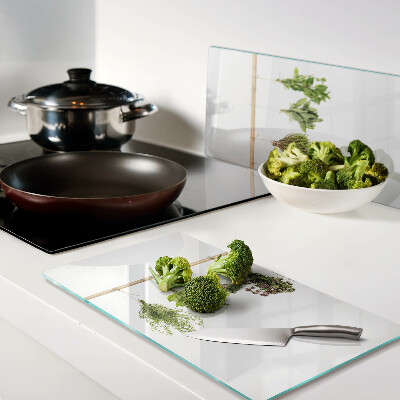 Glass chopping board Herbs dried on a string