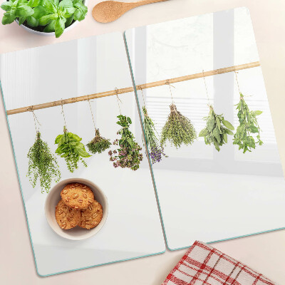 Glass chopping board Herbs dried on a string