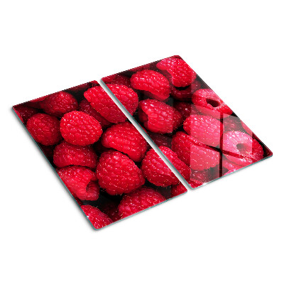 Glass chopping board Raspberries on the background