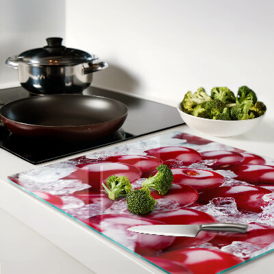 Glass chopping board Red grapes on ice