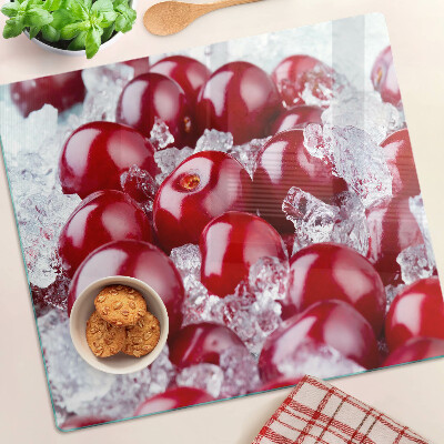 Glass chopping board Red grapes on ice