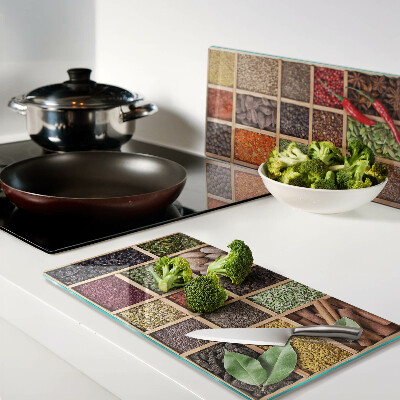 Glass kitchen board Spices in jars