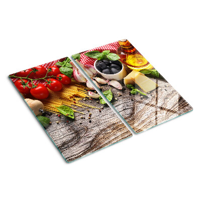 Glass chopping board Italian cuisine with pasta and vegetables