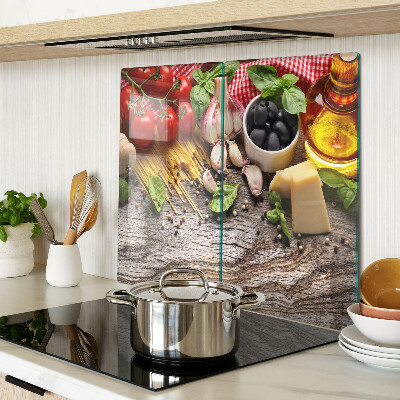 Glass chopping board Italian cuisine with pasta and vegetables