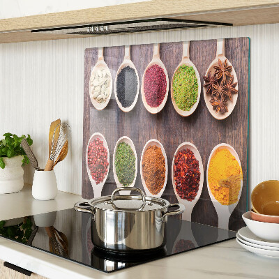 Glass kitchen board Spices in spoons