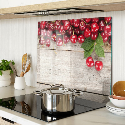 Glass kitchen board Cherries on a wooden background