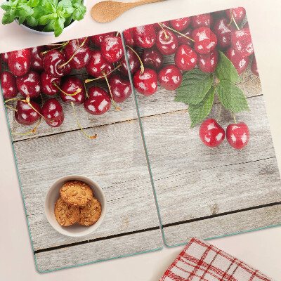 Glass kitchen board Cherries on a wooden background