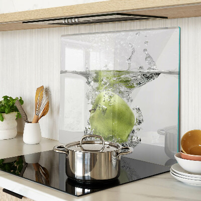 Glass chopping board Green apple in water