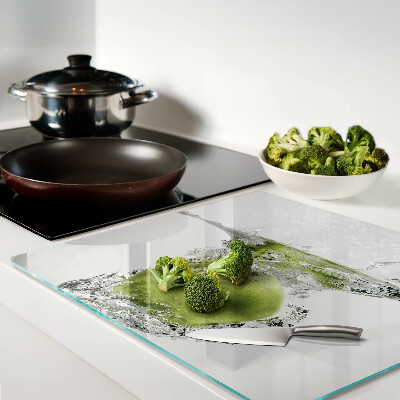 Glass chopping board Green apple in water