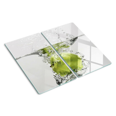 Glass chopping board Green apple in water
