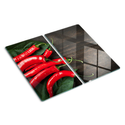 Glass kitchen board Chili peppers on a wooden background