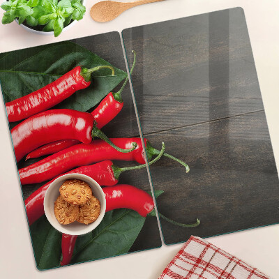 Glass kitchen board Chili peppers on a wooden background