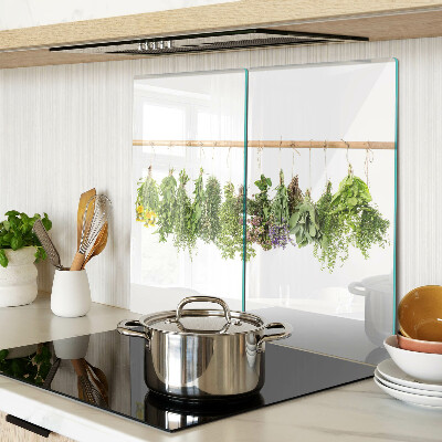 Glass kitchen board Dried herbs on a string