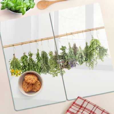 Glass kitchen board Dried herbs on a string