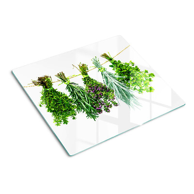 Glass chopping board Dried herbs on a string