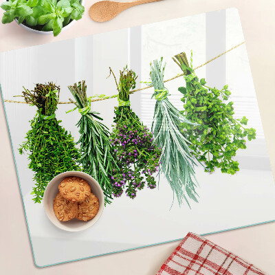 Glass chopping board Dried herbs on a string