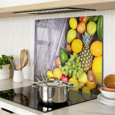 Glass chopping board Fruits on a wooden background