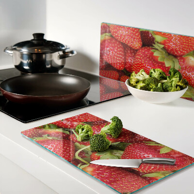 Glass kitchen board Strawberries on the background