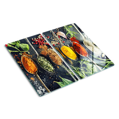 Glass kitchen board Spices in spoons