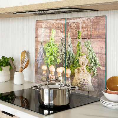 Glass chopping board Herbs and spices on a wood background
