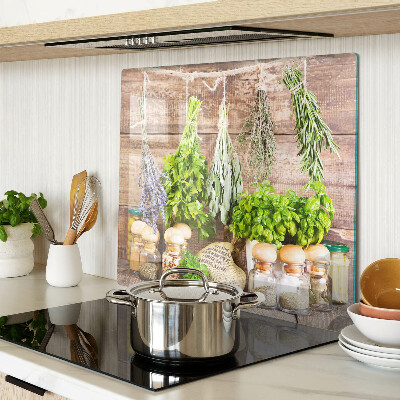 Glass chopping board Herbs and spices in the kitchen