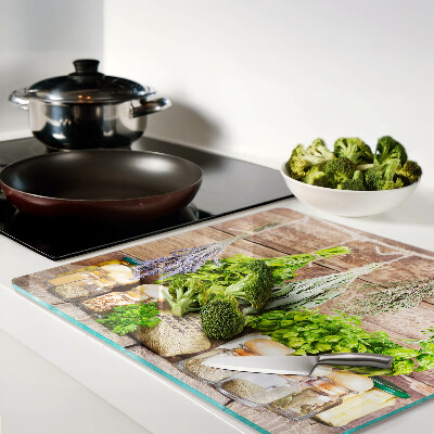 Glass chopping board Herbs and spices in the kitchen