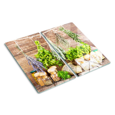 Glass chopping board Herbs and spices in the kitchen