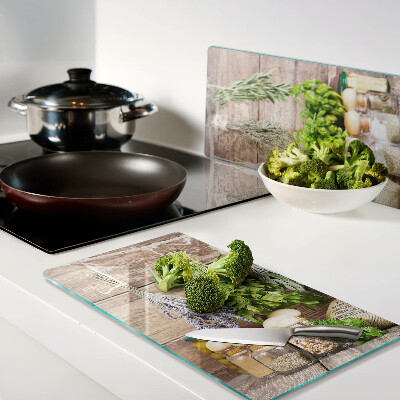 Glass chopping board Herbs and spices in the kitchen