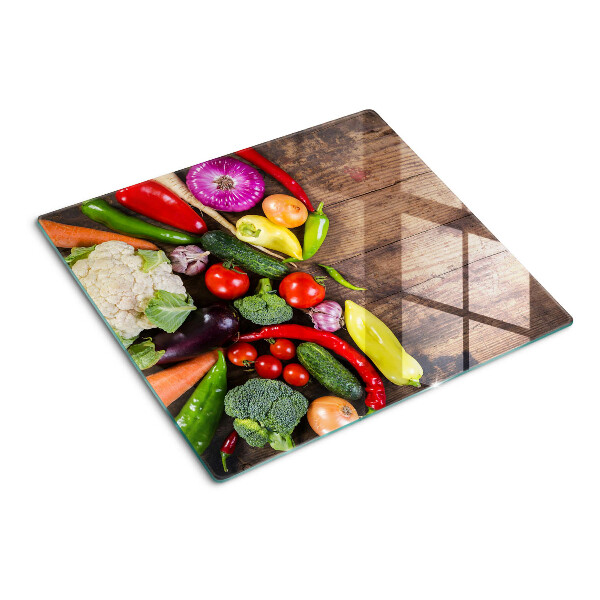 Glass kitchen board Vegetables on a wooden background