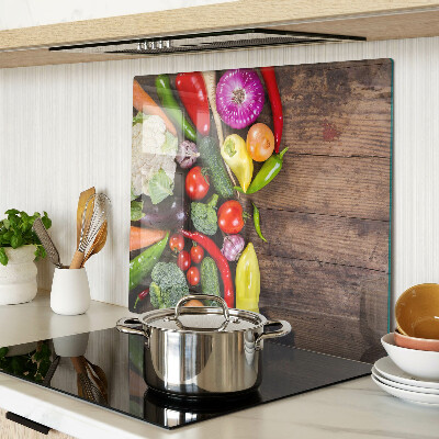 Glass kitchen board Vegetables on a wooden background