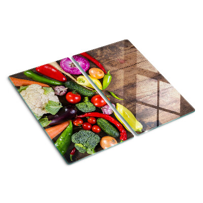 Glass kitchen board Vegetables on a wooden background