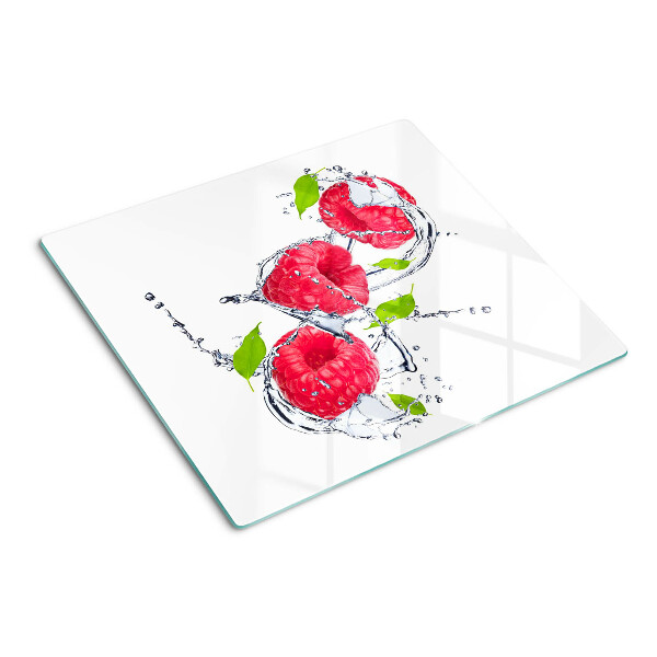 Glass chopping board Raspberries in water with leaves