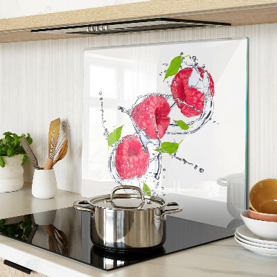 Glass chopping board Raspberries in water with leaves