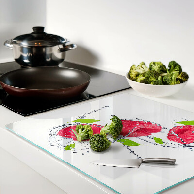 Glass chopping board Raspberries in water with leaves
