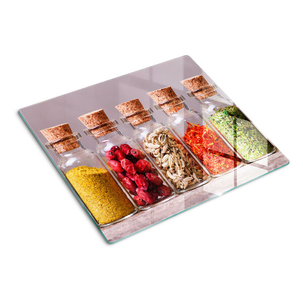 Glass kitchen board Spices in glass jars