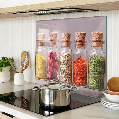 Glass kitchen board Spices in glass jars