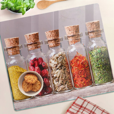 Glass kitchen board Spices in glass jars