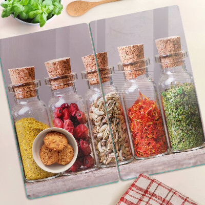 Glass kitchen board Spices in glass jars